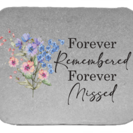 Gray memorial plaque with pastel flowers and the words Forever Remembered Forever Missed