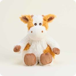 Plush cow toy with white and orange fur