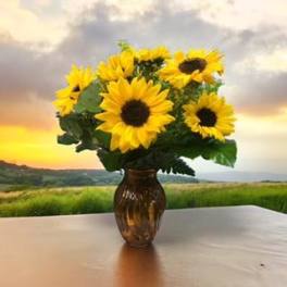 Sunflower bouquet in an amber glass vase