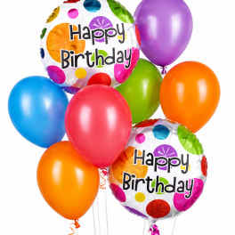 Birthday balloons in bright colors with two "Happy Birthday" foil balloons