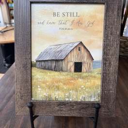 Framed barn print with the words "Be Still and know that I am God"