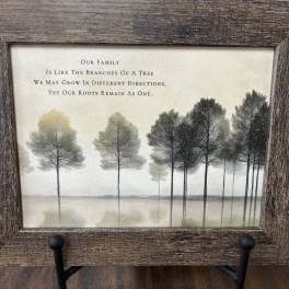 Framed tree artwork with a family quote on a stand