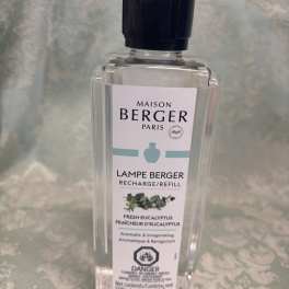 Clear bottle of Maison Berger eucalyptus lamp refill with a black cap
