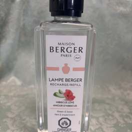 Clear bottle of Maison Berger Lampe Berger refill labeled Hibiscus Love
