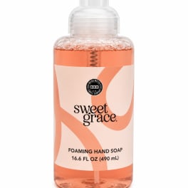Bottle of foaming hand soap with a clear pump and peach-colored liquid