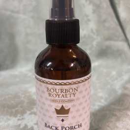 Amber room spray bottle labeled Bourbon Royalty Back Porch