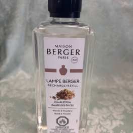 Clear bottle of Maison Berger Paris lamp refill with a dark cap