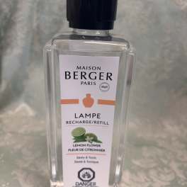 Clear bottle of Maison Berger lemon flower lamp refill with black cap