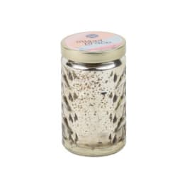 Decorative candle in a glass jar with a metal lid