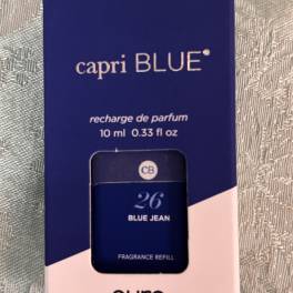 Blue perfume refill box with a small bottle visible through the front window