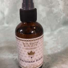 Amber room spray bottle labeled Southern Suede
