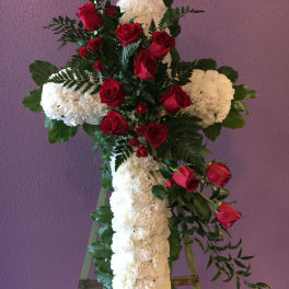 Standing floral cross with red roses and white carnations