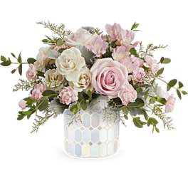 Pink and white roses with small pink blooms in a mosaic vase