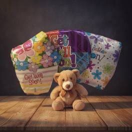Get-well balloon bouquet with a teddy bear in front