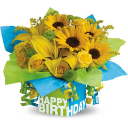 Yellow bouquet in a birthday gift box with ribbon curls
