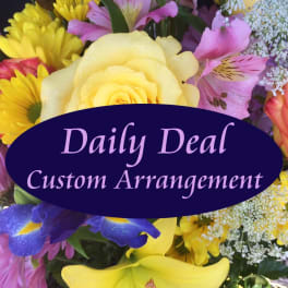 Mixed bouquet with yellow roses, lilies, and pink flowers