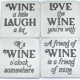 Four white coasters with black wine-themed sayings