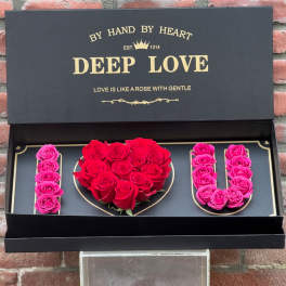 Black gift box with red and pink roses arranged as "I LOVE U"