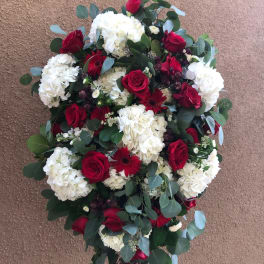 Standing floral spray with red roses and white hydrangeas