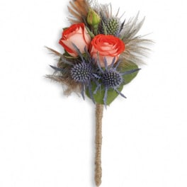 Small bouquet with coral roses and blue thistle on a wrapped stem