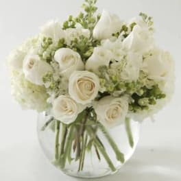 White rose bouquet in a clear glass vase