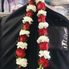 Red roses and white carnations arranged in two hanging garlands
