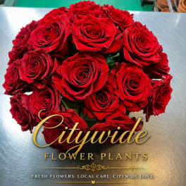 Bouquet of red roses on a metallic surface