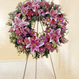 Pink and purple funeral wreath on a standing easel