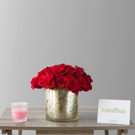 Red roses arranged in a gold vase on a table
