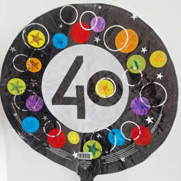 Round black balloon with a large white 40 and colorful circles