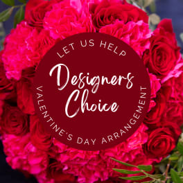 Round bouquet of hot pink and red roses with a decorative sign