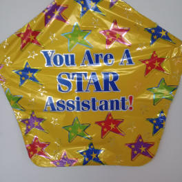 Yellow star-shaped balloon with multicolored stars and the words "You Are A STAR Assistant!"