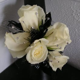 Cream rose bouquet with black ribbon and jeweled accents