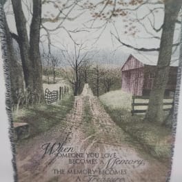 Fringed throw blanket with a rustic barn and memorial quote