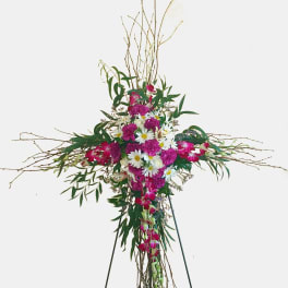 Tall floral standing spray with pink and white flowers on a tripod easel