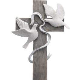 Wooden cross with three white doves