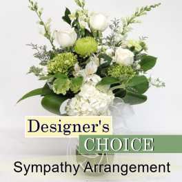 White and green sympathy arrangement with roses and hydrangea in a vase