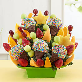 Fruit bouquet with chocolate-dipped strawberries in a green container