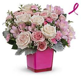 Pink and white rose bouquet in a magenta vase with a ribbon accent
