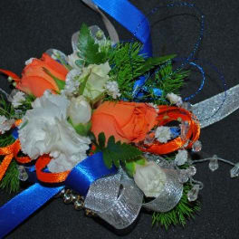 Orange and white floral corsage with blue and silver ribbons