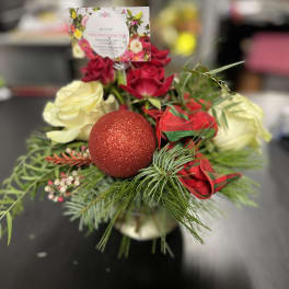 Red and white roses with a glittery red ornament and ribbon
