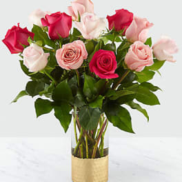 Bouquet of pink and red roses in a clear glass vase