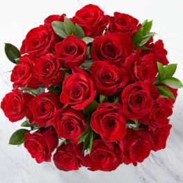 Bouquet of red roses with green leaves