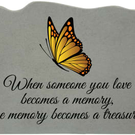 Gray memorial plaque with a butterfly and sympathy quote