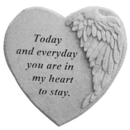 Heart-shaped memorial stone with engraved text and angel wings