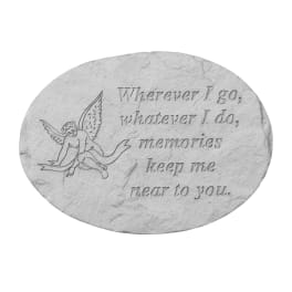 Oval memorial stone with an angel and engraved quote