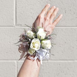 White rose wrist corsage with ribbon accents
