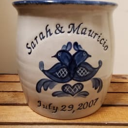 Ceramic pot with blue bird design and names painted on the front