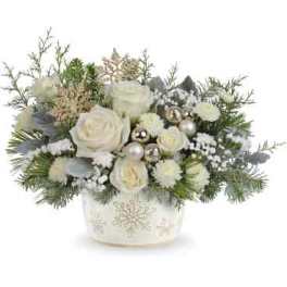 White roses in a decorated holiday container with silver ornaments