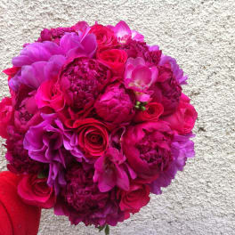 Round bouquet of hot pink and purple flowers